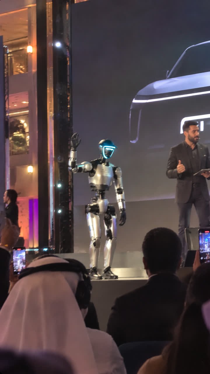Humanoid robot on stage at a vehicle launch